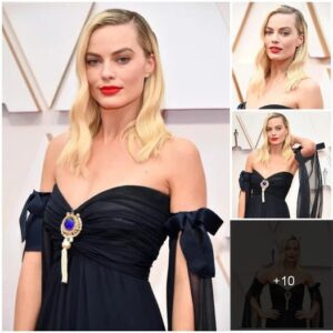 Margot Robbie looking high class in a black outfit