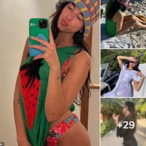 Dua Lipa poses in a flowery bikini and angelic white dress