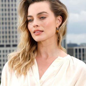 Margot Robbie displaying her sensual elegance in a mesmerizing outfit