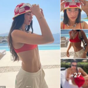 Dua Lipa shows off her stunning figure in a tiny red bikini paired with a trendy bucket hat