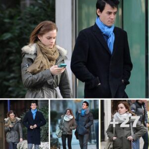 Is he boring you? Emma Watson only has eyes for her mobile phone as she heads out on a stroll with boyfriend Will Adamowicz