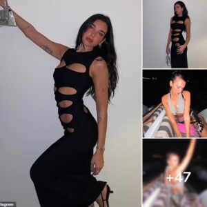 Dua Lipa flashes her abs in figure-hugging black dress as she continues her sunny St. Barts break