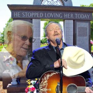 He took off his hat… and for a moment, time stood still. At George Jones’s funeral in 2013, Alan Jackson stepped onto the Grand Ole Opry stage and began jiji