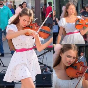 “She’s just a girl on a sidewalk,” someone whispered — but then her bow touched the strings, and time seemed to stop. Karolina Protsenko stood in jiji