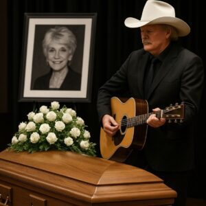 No press. No spotlight. Alan Jackson arrived quietly at Jeannie Seely’s funeral — just a man in black, stepping into sacred silence. The chapel, soft with white flowers and golden light, seemed to hold its breath as he stood. jiji