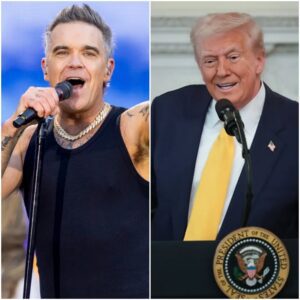 🎤 ROBBIE WILLIAMS CONFRONTS DONALD TRUMP OVER “I’M A BELIEVER” RALLY MOMENT: A CLASH THAT TURNED INTO A NATIONAL FLASHPOINT